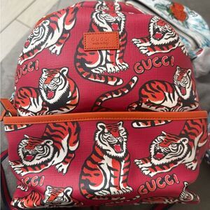 Brand new small Gucci Red Tiger Print Backpack comes with dustbag